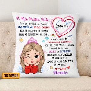May include: White pillow with a colourful illustration of a girl with a crown and a heart that says "Louise". The text reads "À Ma Petite Fille" and "Je T'aime Mamie".