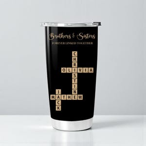 May include: Black stainless steel tumbler with the text "Brothers & Sisters FOREVER LINKED TOGETHER" in gold script. The tumbler features a crossword-style design with names like Olivia, Matthew, and Jack. A stylish and personalized gift.