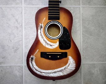 Hand-Painted Guitar Wall Art: Feathered Stargazer Decor