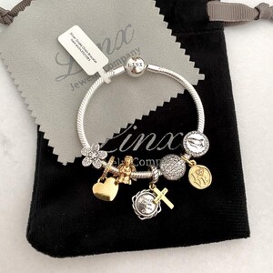Linx Silver Snake Chain Bracelet with Silver and Gold Religious Themed Charms