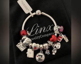 Linx armband med lärartema berlocker