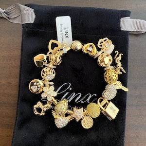 Linx Yellow Gold Snake Chain Bracelet with Gold and Cubic Zirconia Themed Charms
