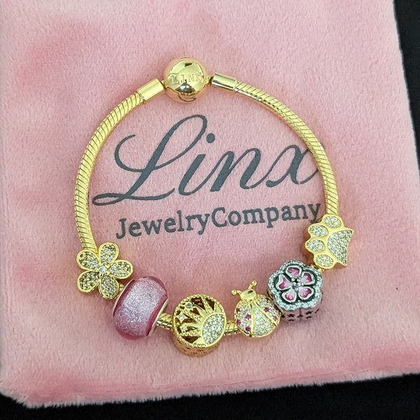 Linx Yellow Gold Snake Chain Bracelet with Pink and Gold Themed Charms