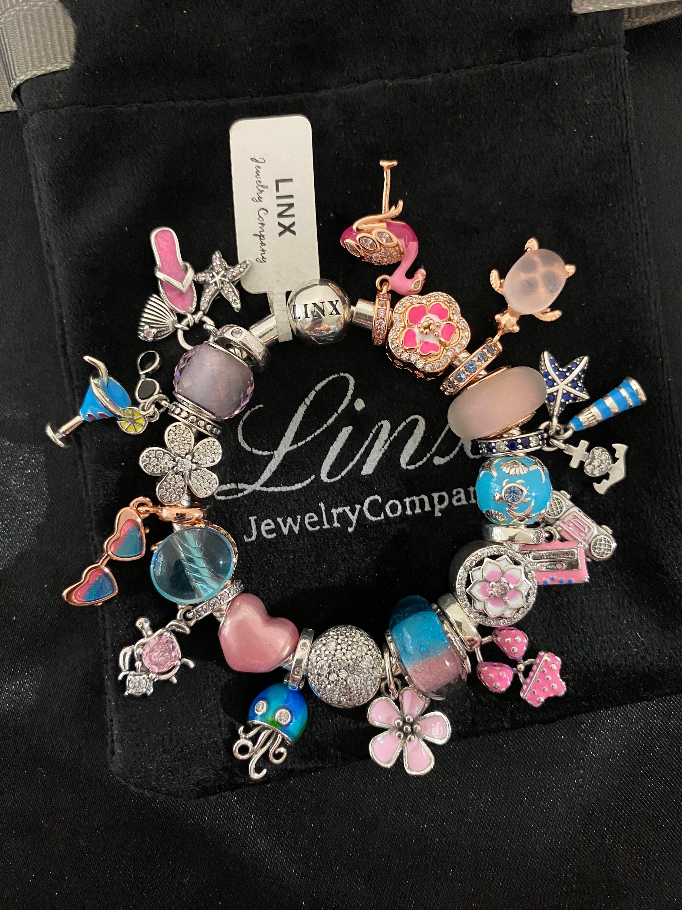 il_fullxfull.5862600531_hq9r.jpg Linx Snake Chain Bracelet with Pale Pink and Baby Blue Themed Charms main image 0