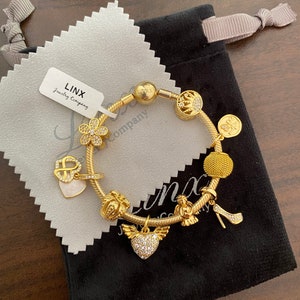 Yellow Gold Charm Bracelet: Sterling Silver Snake Chain, Linx Charms