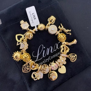 Linx Yellow Gold Snake Chain Bracelet with Gold and Cubic Zirconia Themed Charms