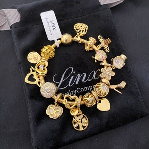Linx Yellow Gold Snake Chain Bracelet with Gold and Cubic Zirconia Themed Charms