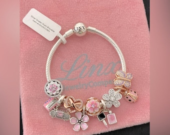Pulsera con dijes de cadena de serpiente de oro rosa: dijes rosas de plata esterlina