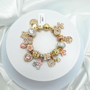 Linx Yellow Gold Snake Chain Bracelet with Gold and Peach Themed Charms