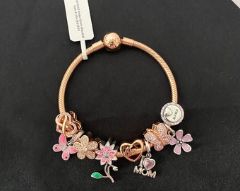 ローズゴールド、ピンク、シルバーのママをテーマにしたチャーム付き