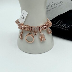 Linx Rose Gold Snake Chain Bracelet with Mom and Queen Themed Charms