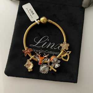 Linx Gelbgold Schlangenkette Armband mit weihnachtlichen Charms