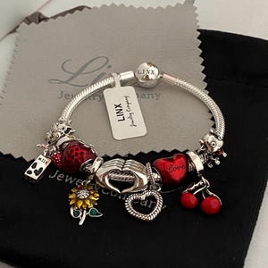 Linx Sterling Silver Charm Bracelet: Snake Chain with Themed Charms