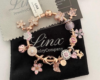 Pulsera Linx con dije de oro rosa: Flor rosa en plata de ley