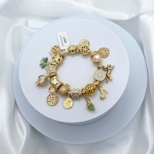 Linx Yellow Gold Snake Chain Bracelet with Green and Gold Charms
