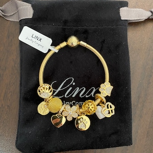 Linx Yellow Gold Snake Chain Bracelet with Gold and Cubic Zirconia Themed Charms