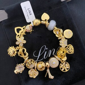 Linx Yellow Gold Snake Chain Bracelet with Gold and Cubic Zirconia Themed Charms