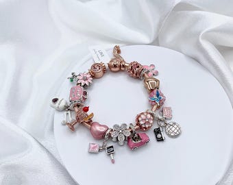 Pulsera de dijes de oro rosa: cadena de serpiente de plata de ley, 16 dijes