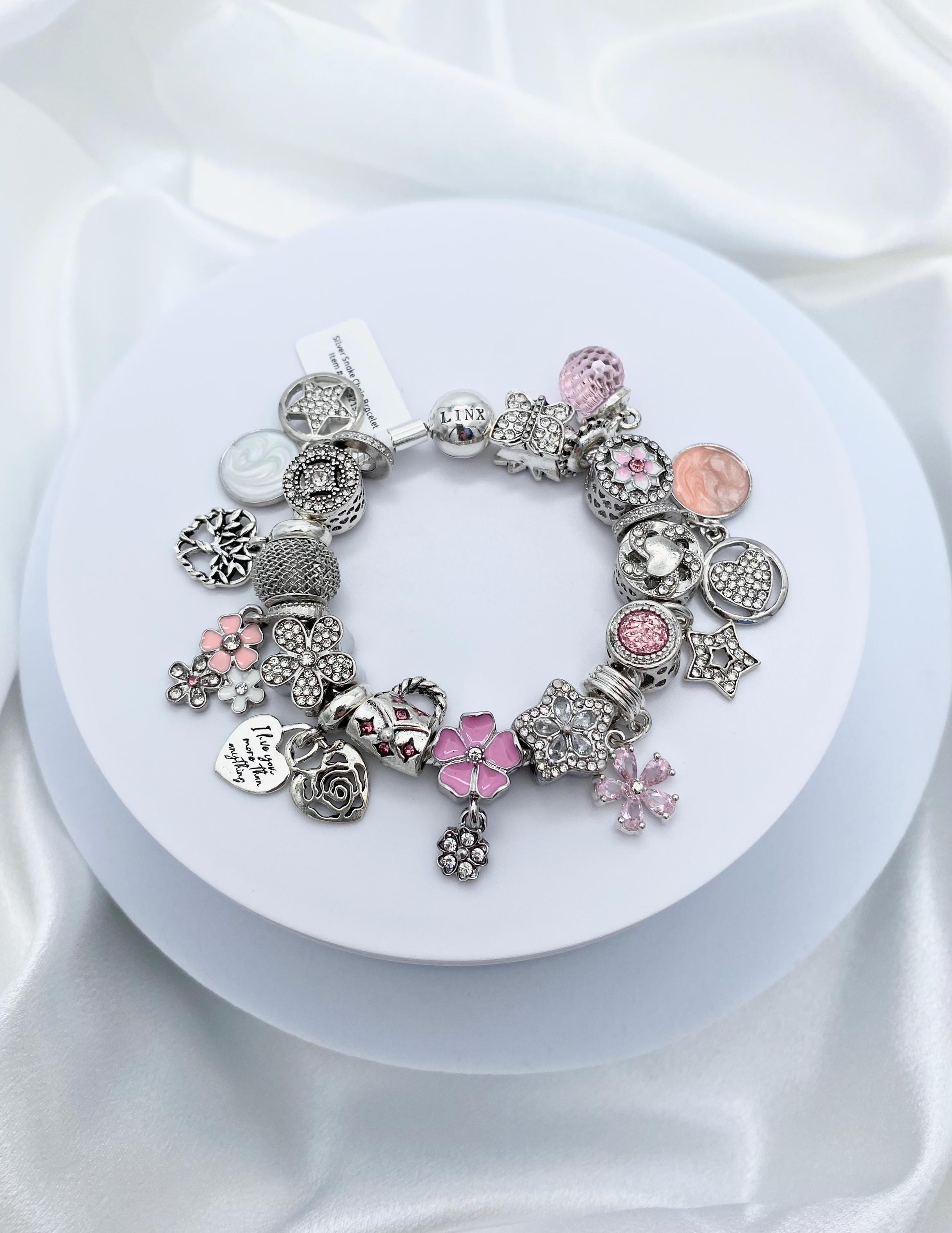il_fullxfull.5862600531_hq9r.jpg Linx Snake Chain Bracelet with Pale Pink and Baby Blue Themed Charms main image 1