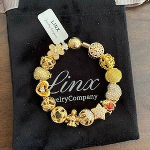 Linx Yellow Gold Snake Chain Bracelet with Gold Charms