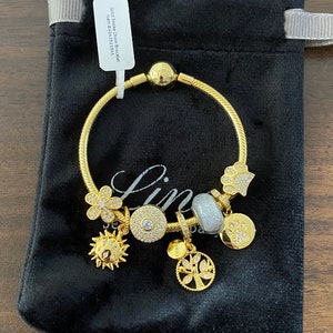 Linx Yellow Gold Snake Chain Bracelet with Gold and Cubic Zirconia Themed Charms