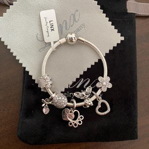 Pulsera de cadena de serpiente de plata Linx con dijes de petauro del azúcar