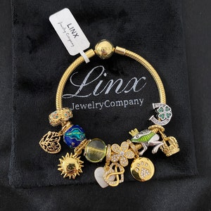 Linx Yellow Gold Snake Chain Bracelet with Green and Gold Charms
