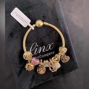 Linx Yellow Gold Snake Chain Bracelet with Gold and Cubic Zirconia Themed Charms