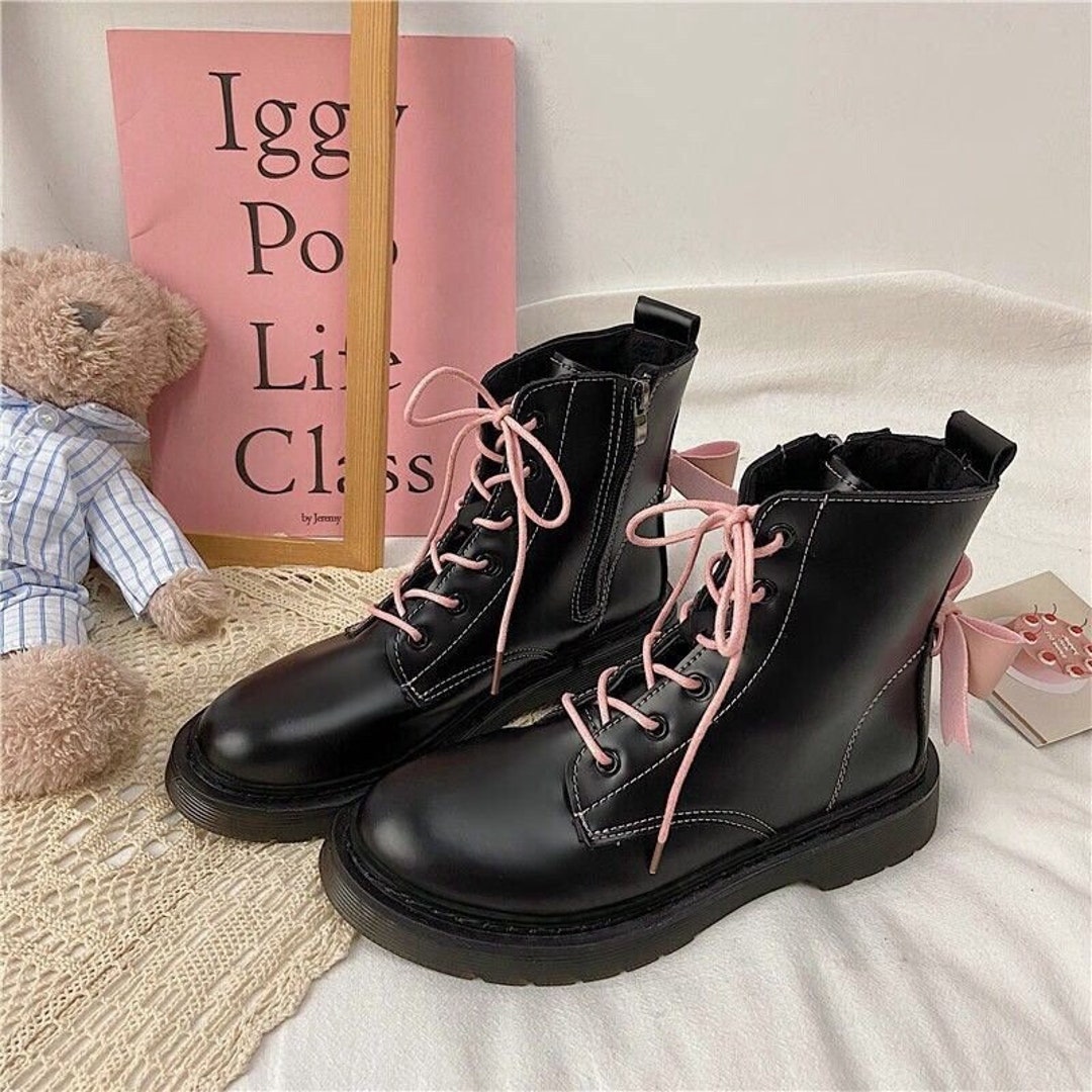 black boots with pink laces
