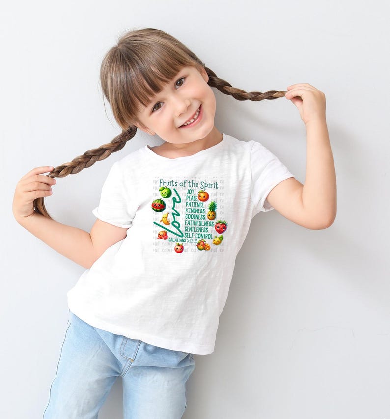 May include: A white t-shirt with a graphic of fruit and the text "Fruits of the Spirit" and "Love" with the words "Joy, Peace, Patience, Kindness, Goodness, Faithfulness, Gentleness, Self Control" listed vertically. The text "Galatians 5:22-23" is at the bottom of the graphic.