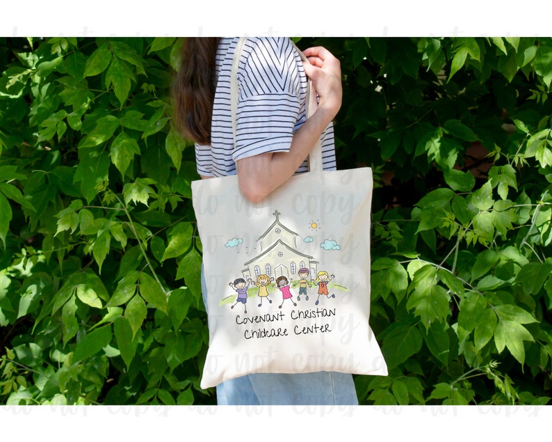 May include: A white tote bag with a cartoon illustration of a church and children. The text on the bag reads "Covenant Christian Childcare Center".