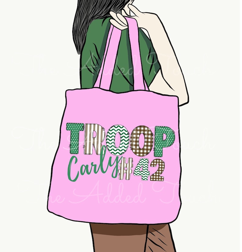 May include: Pink tote bag with the text "TROOP Carly #42" in green and brown patchwork letters.