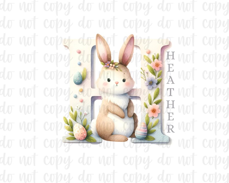May include: A white letter H with a light blue background. A brown bunny with a pink nose and white whiskers is standing next to the letter. The bunny is wearing a flower crown. The letter is decorated with pink, purple, and white flowers. The word "HEATHER" is written vertically on the right side of the letter.