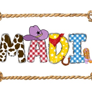 May include: A colorful, personalized name sign with the name "MADI" spelled out in large letters. Each letter is decorated with different patterns, including cowhide, gingham, and stars. A purple cowboy hat sits on top of the "M" and a pair of pink cowboy boots are next to the "I". The sign is framed with a brown rope border.