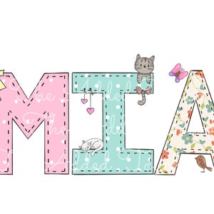 May include: The name MIA is spelled out in colorful fabric letters. The letter M is pink with white polka dots, the letter I is turquoise with white polka dots, and the letter A is cream with a floral pattern. A yellow bow is on the left side of the M, a cat is on the I, a butterfly is above the A, and a bird is below the A.