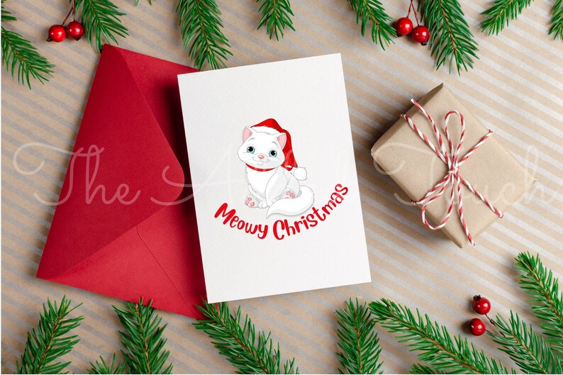May include: A Christmas card with a white cat wearing a Santa hat and the words "Meowy Christmas" in red. A red envelope, a wrapped gift, and evergreen branches with red berries complete the festive scene.