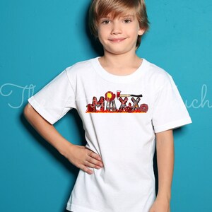 May include: A white t-shirt with a red, yellow, and black graphic of the name "MAXX" with firefighter imagery.