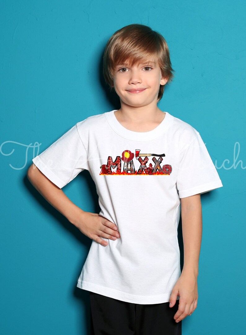 May include: A white t-shirt with a red, yellow, and black graphic of the name "MAXX" with firefighter imagery.