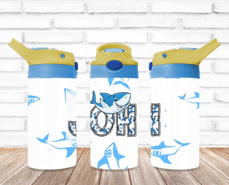 May include: A blue and yellow water bottle with a shark design and the name "John" printed on it.