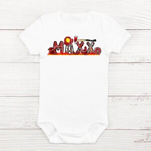 May include: White baby bodysuit with a red, yellow, and black firefighter themed design. The design includes a firefighter helmet, axe, and fire hose. The name "MAXX" is spelled out in the design.