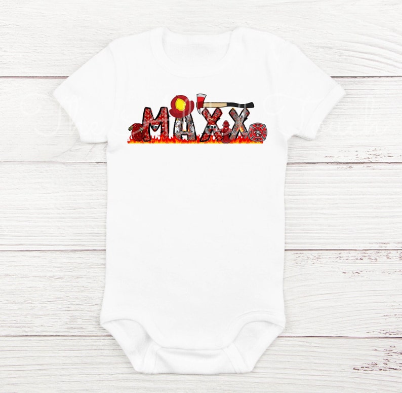 May include: White baby bodysuit with a red, yellow, and black firefighter themed design. The design includes a firefighter helmet, axe, and fire hose. The name "MAXX" is spelled out in the design.