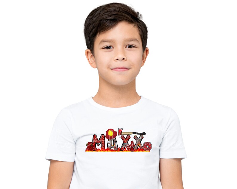 May include: A white t-shirt with the name "MAXX" spelled out in red letters with a firefighter theme. The letters are decorated with images of fire hoses, axes, and fire helmets.