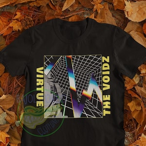 May include: Black t-shirt with a graphic design featuring a colorful, geometric pattern and the text "Virtue The Voidz".