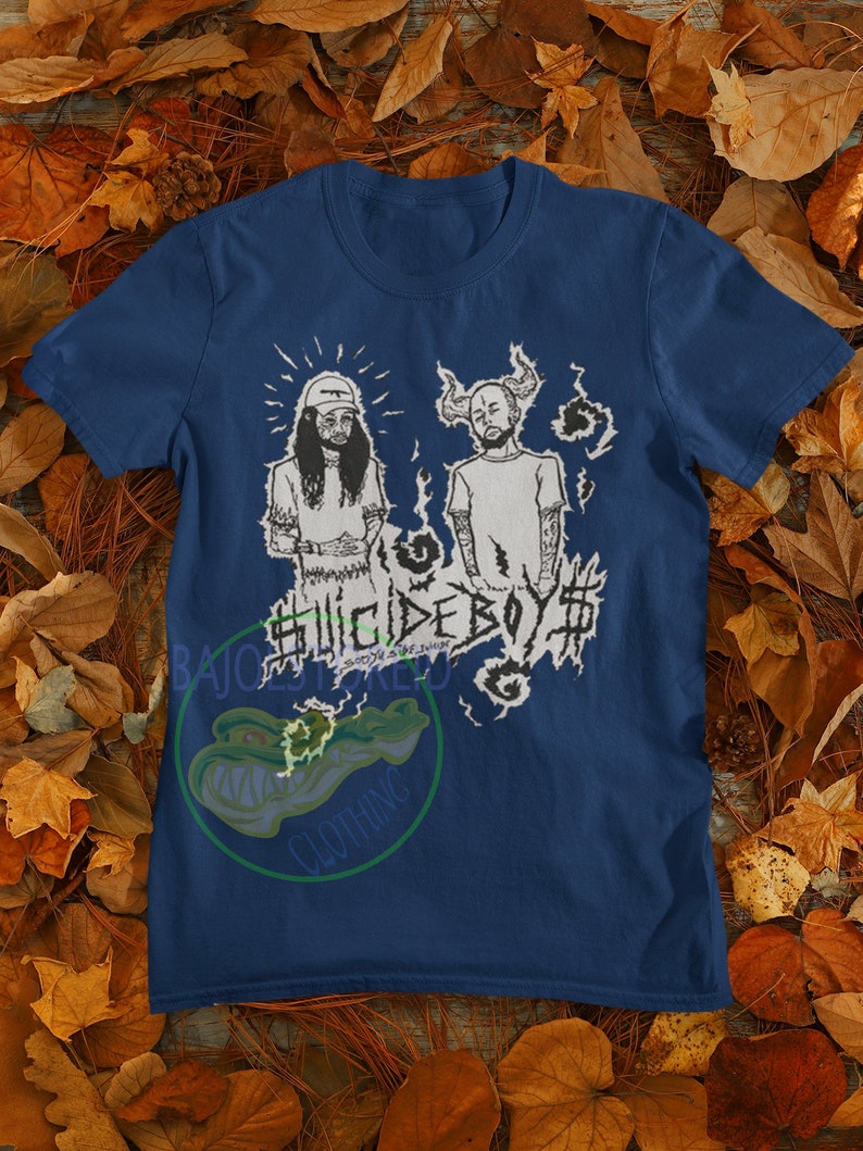 May include: A navy blue t-shirt with a white graphic print of two figures with the text "#SUICIDEBOY$#" in a stylized font.
