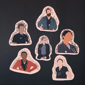 May include: A set of five die-cut stickers featuring illustrated medical professionals in scrubs with stethoscopes. Each sticker includes a unique quote written in black text along the border, such as "Never Apologize For Feeling Something For Your Patients" and "I Use Sarcasm And Comedy As A Shield."