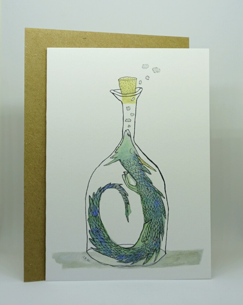 May include: A watercolor illustration of a green and blue dragon curled up inside a glass bottle with a cork stopper. The dragon's tail is curled around its body, and its head is peeking out of the top of the bottle. There are small yellow circles around the cork, representing bubbles.