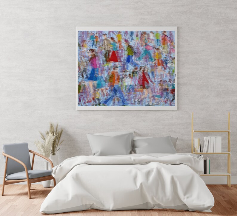 May include: A framed abstract painting of a crowd of people in various colors and patterns. The painting is hanging on a light gray wall above a white bed with gray pillows.