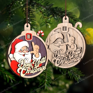 May include: Two wooden Christmas ornaments with Santa Claus and the text "Days Until Christmas". The ornaments are brown with a wood grain texture and have a red and white candy cane design. The ornaments are numbered "1" and are ready to be hung on a Christmas tree.