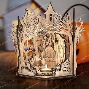 May include: A wooden Halloween candle holder featuring a graveyard scene. The design includes a haunted house, ghosts, trees, and a pumpkin. A lit candle sits in the center, creating a warm glow. The intricate laser-cut details create a dimensional effect.