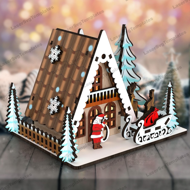 May include: A wooden Christmas house with a brown roof, white trim, and a Santa Claus figure standing in front. The house has a fence and two small trees on either side. There is a sleigh with a red bag in front of the house.